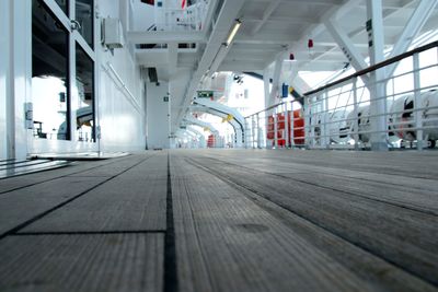 Surface level of empty footpath in illuminated building