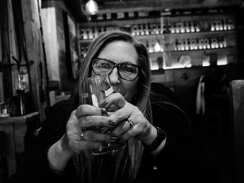 Portrait of smiling man holding drink