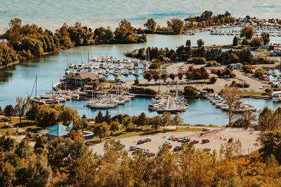 High angle view of lake and trees against sky