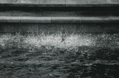 High angle view of water splashing on sea