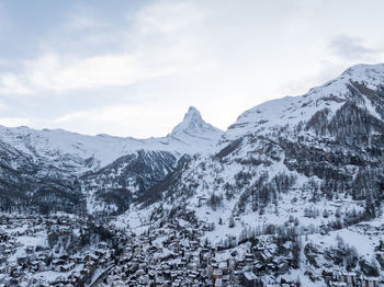 Scenic view of snowcapped mountains against sky