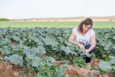 Full length of woman standing on field