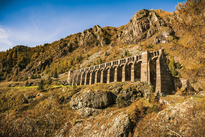 Arch bridge against mountain