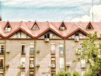 Houses against sky in city