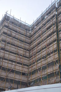 Low angle view of construction site against sky