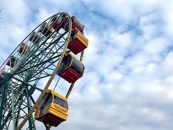 Low angle view of ferris wheel against sky