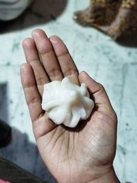 Close-up of hand holding ice cream