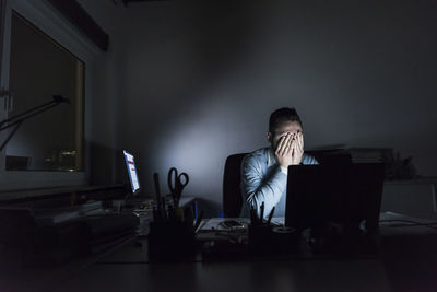 Man using laptop on table