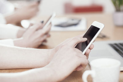 Close-up of woman holding mobile phone