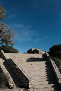 Low angle view of built structure against blue sky