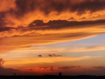 Scenic view of dramatic sky during sunset