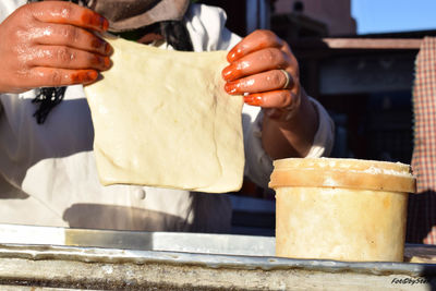 Close-up of man preparing food