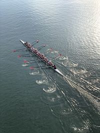 High angle view of people rowing boat in lake