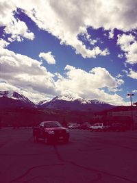 Scenic view of mountains against cloudy sky