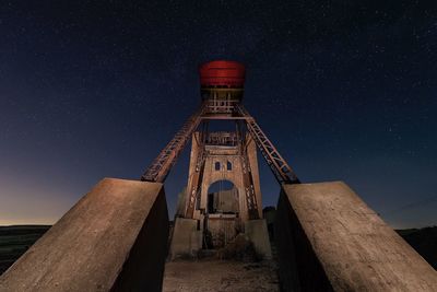 Low angle view of historical building against sky at night