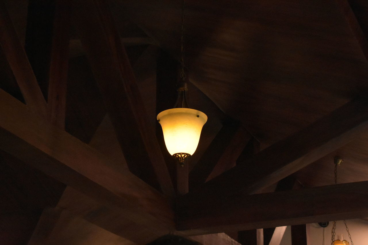 lighting equipment, illuminated, indoors, ceiling, low angle view, no people, electricity, hanging, glowing, electric light, light bulb, light, yellow, close-up, architecture, electric lamp, wood - material, pattern, pendant light, built structure, dark, light fixture