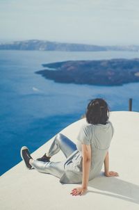 Rear view of boy looking at sea