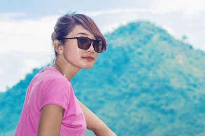 Portrait of young woman looking away