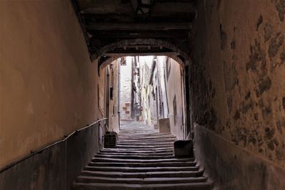 Narrow corridor along old building