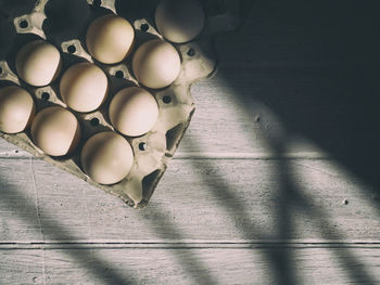 Directly above view of egg carton on table