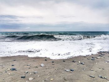 Scenic view of beach against sky