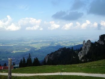 Scenic view of mountains against cloudy sky