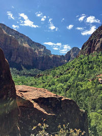 Scenic view of mountains against cloudy sky