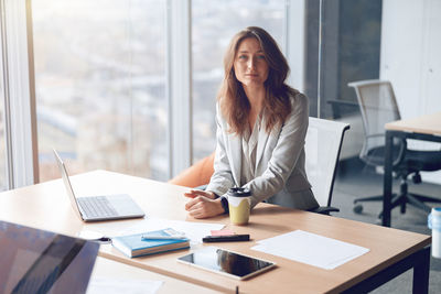 Businesswoman working at desk in office