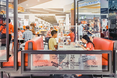 Rear view of people at subway station