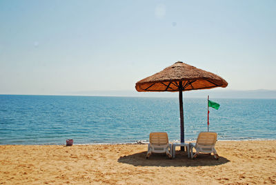 Two chairs by the beach