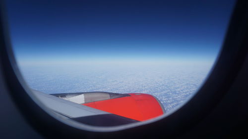 Aerial view of landscape seen through airplane window