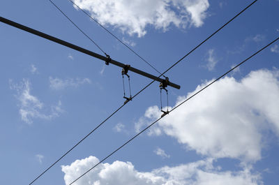 Low angle view of power lines against sky