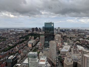 High angle view of buildings in city against sky