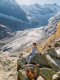 Rear view of woman walking on mountain