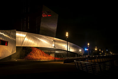 Illuminated bridge against sky in city at night