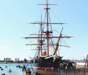 Boats moored at harbor