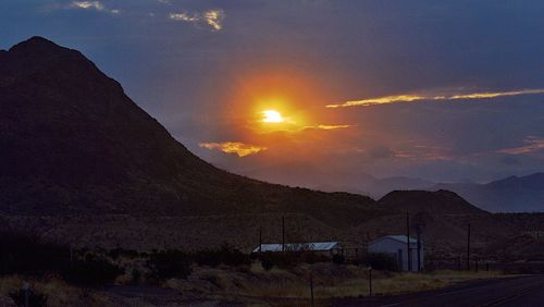 Scenic view of mountains against sky at night