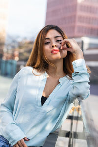 Portrait of smiling woman standing outdoors