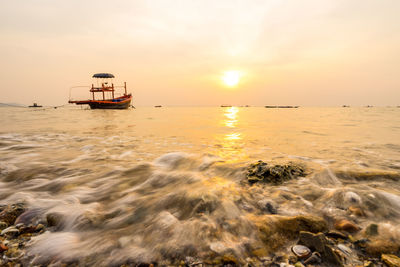 Scenic view of sea against sky during sunset