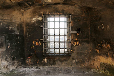 Photo of a window for observation on the wall of edinburgh castle in scotland, england