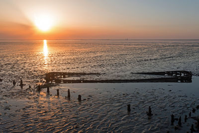 Aerial from an old ship wreck in the wadden sea in the netherlands at sunset