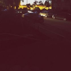 Cars on street in city at night
