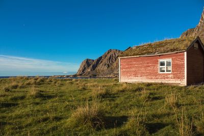 House on field against sky