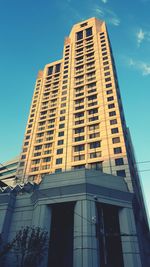 Low angle view of building against blue sky