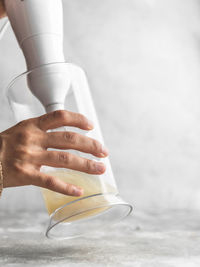 Close-up of hand holding ice cream