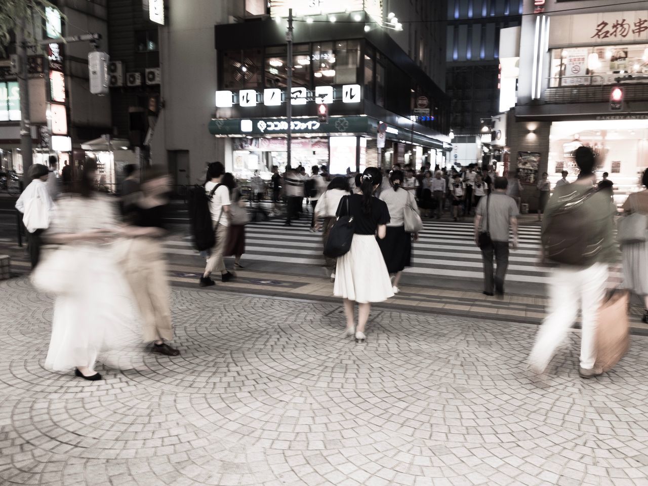 blurred motion, motion, city, group of people, architecture, walking, crowd, city life, transportation, women, street, real people, large group of people, adult, built structure, building exterior, speed, men, on the move, crossing, outdoors, busy