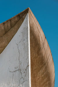 Low angle view of building against clear blue sky