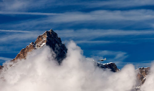 Scenic view of snow covered mountains against sky