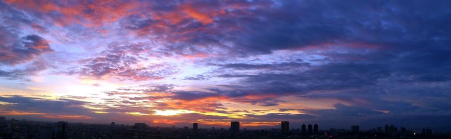 Aerial view of city during sunset