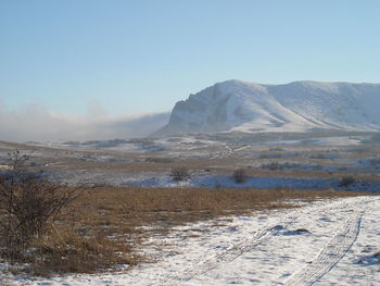 Scenic view of snowcapped mountains against sky